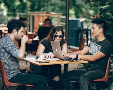 Group of people around a coffee table working
